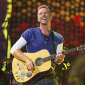 FILE - Chris Martin of Coldplay performs at Metlife Stadium on Aug. 1, 2017, in East Rutherford, N.J.  Coldplay's latest album, Music of the Spheres, releases Oct. 15.  (Photo by Scott Roth/Invision/AP, File)