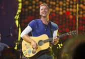 FILE - Chris Martin of Coldplay performs at Metlife Stadium on Aug. 1, 2017, in East Rutherford, N.J.  Coldplay's latest album, Music of the Spheres, releases Oct. 15.  (Photo by Scott Roth/Invision/AP, File)