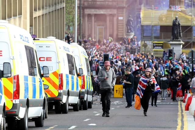 Rangers fans celebrate winning the Scottish Premiership in George Square, Glasgow, after their match against Aberdeen.