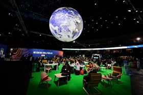 Delegates in the action zone at COP26 in Gasgow. Two years on, Scots are having an impacat at COP28 in Dubai (Picture:Paul Ellis/AFP via Getty Images)