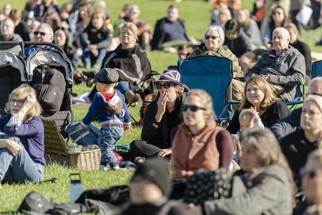 Members of the public watch Queen Elizabeth II's state funeral live in Holyrood Park