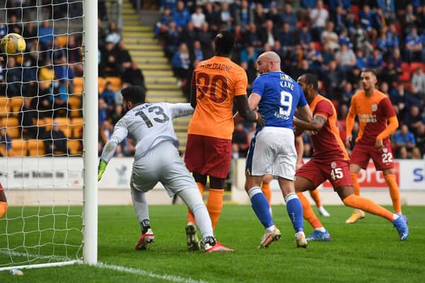 Chris Kane pressures Galatasaray goalkeeper Ismail Cipe into scoring the own goal that brought St Johnstone level. (Photo by Craig Foy / SNS Group)