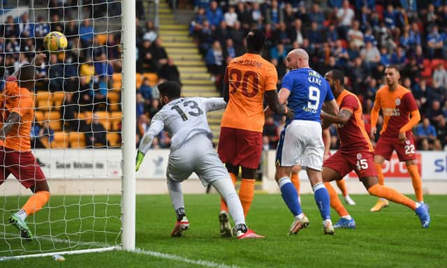 Chris Kane pressures Galatasaray goalkeeper Ismail Cipe into scoring the own goal that brought St Johnstone level. (Photo by Craig Foy / SNS Group)