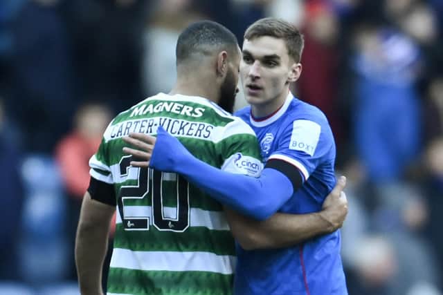 Former Rangers defender James Sands (R) with Celtic's Cameron Carter-Vickers after the 2-2 draw at Ibrox on January 2. (Photo by Rob Casey / SNS Group)