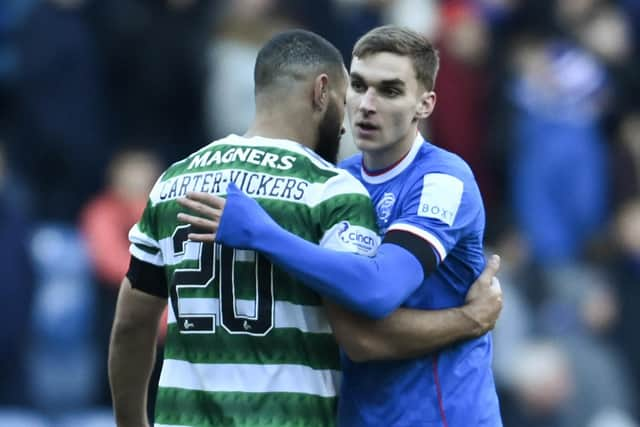 Former Rangers defender James Sands (R) with Celtic's Cameron Carter-Vickers after the 2-2 draw at Ibrox on January 2.  (Photo by Rob Casey / SNS Group)