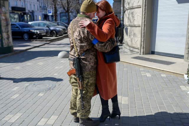 Igor, a 40 year-old Ukrainian soldier, embraces his wife in Odessa, feared to be Russian forces next target (Picture: Bulent Kilic/AFP via Getty Images)