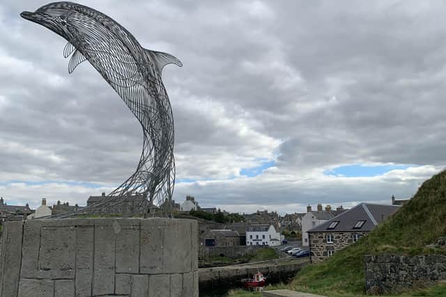 Carn Standing’s dolphin sculpture, which celebrates the pods of bottle-nose dolphins that cruise local waters, at Portsoy harbour.