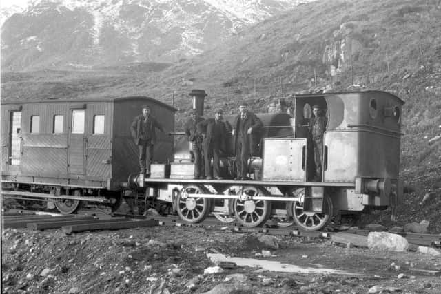 Workers pose for a photograph aboard a construction locomotive. Picture: Glenfinnan Station Museum