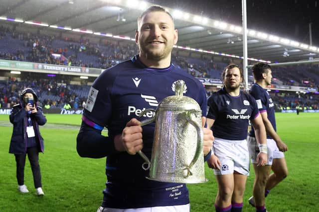 Scotland's Finn Russell with the Calcutta Cup after the 20-17 win over England at Murrayfield in 2022. (Photo by Craig Williamson / SNS Group)
