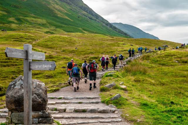 People walking along the mountain track to the summit of Ben Nevis (pic: Apostolos Giontzis/Getty Images)