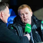 Neil Lennon chats to BT Sport's Chris Sutton (left) during his time as manager of Hibs. (Picture: SNS)
