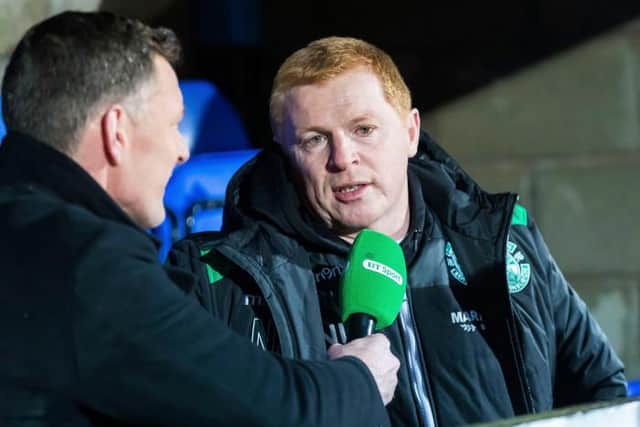 Neil Lennon chats to BT Sport's Chris Sutton (left) during his time as manager of Hibs. (Picture: SNS)