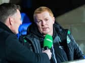 Neil Lennon chats to BT Sport's Chris Sutton (left) during his time as manager of Hibs. (Picture: SNS)