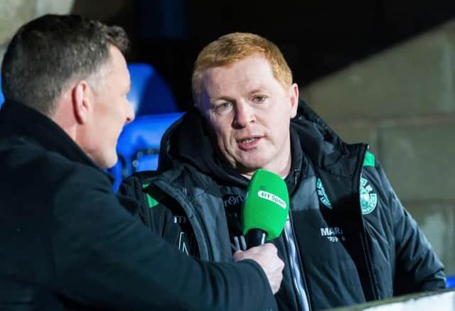 Neil Lennon chats to BT Sport's Chris Sutton (left) during his time as manager of Hibs. (Picture: SNS)