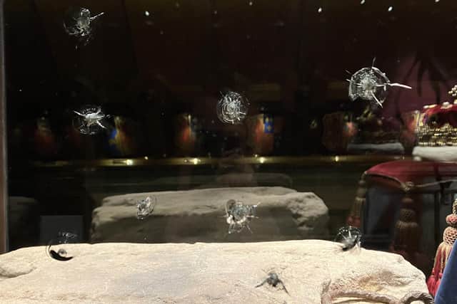 Damage to the protective glass housing the Stone of Destiny at Edinburgh Castle in a protest against food poverty. Picture: Historic Environment Scotland/PA Wire