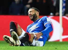 Rangers' Connor Goldson goes down in agony during the Liverpool match.