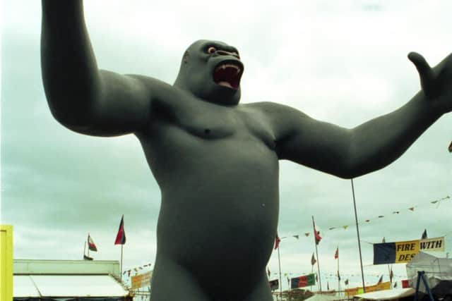The giant King Kong figure towers over bargain hunters at Ingliston Sunday Market near Edinburgh, July 1991.