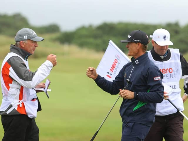 American Berry Henson celebrates an eagle with his caddie on the 12th hole during the second round of the Hero Open at Fairmont St Andrews. Picture: Andrew Redington/Getty Images.