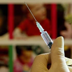 A nurse handles a syringe at a medical centre in Kent. Picture: PA