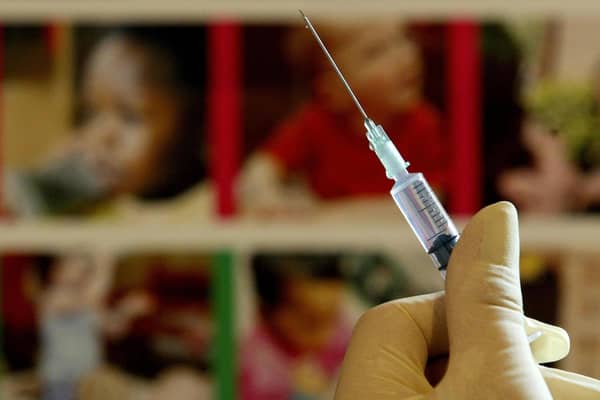 A nurse handles a syringe at a medical centre in Kent. Picture: PA