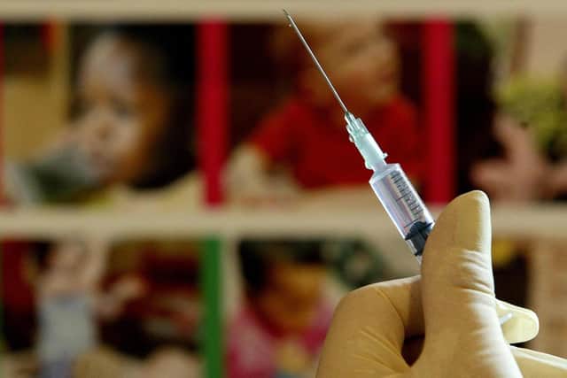 A nurse handles a syringe at a medical centre in Kent. Picture: PA