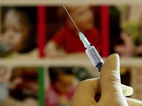 A nurse handles a syringe at a medical centre in Kent. Picture: PA