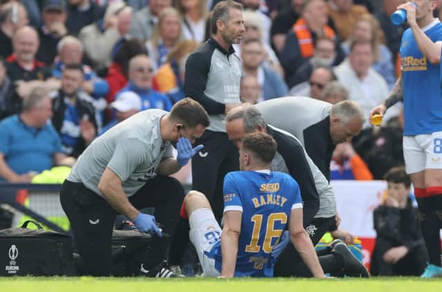 Rangers Aaron Ramsey receives medical attention during the Scottish Cup semi final match against Celtic.