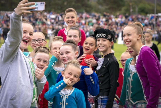 Highland Dancers pose for a selfie during the Braemar Royal Highland Gatheringe