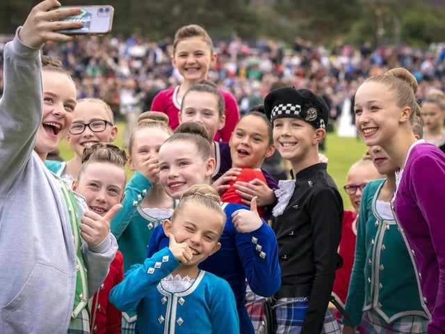 Highland Dancers pose for a selfie during the Braemar Royal Highland Gatheringe