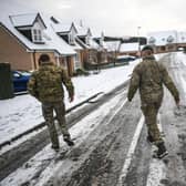 Marines from 45 Commando conduct welfare checks in Lumphanan, Aberdeenshire, after Storm Arwen left many people without power (Picture: Peter Summers/Getty Images)
