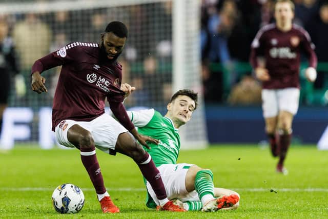 Beni Baningime (left) of Hearts in action against Dylan Levitt of Hibs during the last derby at Easter Road.