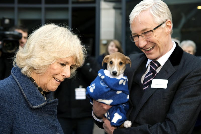 The Queen Consort, then the Duchess of Cornwall, with television presenter Paul O'Grady during her visit to Battersea Dogs & Cats Home in London. TV presenter and comedian Paul O'Grady has died at the age of 67, his partner Andre Portasio has said.