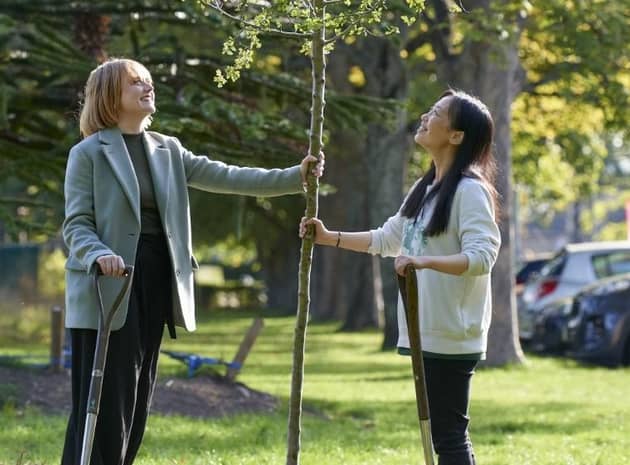 From left: Maggie Hicks, founder of SynSense, and Xiaoyan Ma, founder of Danu Robotics, plant a Hawthorn tree to mark the 100-plus start-ups supported by Edinburgh Innovations over the last year. Picture: Callum Bennetts – Edinburgh Innovations.