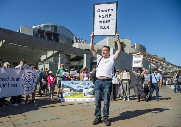 Campaigners gather outside Holyrood to protest short-term let licensing plans (Picture: Lisa Ferguson)