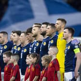 Scotland players line up during the national anthem prior to the win over Spain at Hampden in March. (Photo by Ross MacDonald / SNS Group)