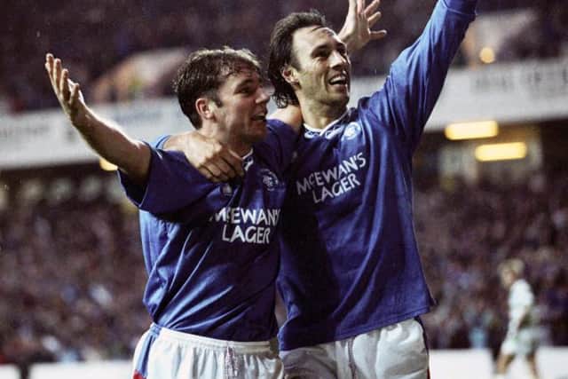 Ally McCoist (left) celebrates with Mark Hateley after giving Rangers a 1-0 lead against Celtic in 1991 (Picture: SNS)