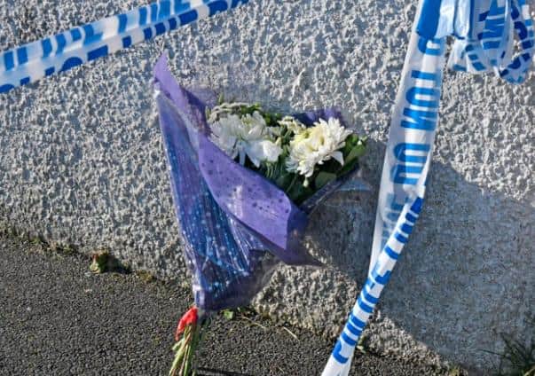 Flowers that were left by sympathisers at the scene of what the PSNI have described as a œsuspicious death  at a house at Carrickdale Gardens off the Tandragee Road in Portadown, County Armagh. The woman, in her late twenties, who has died has been named locally as Kerrie King who came originally from Scotland. Photo by Alan Lewis.