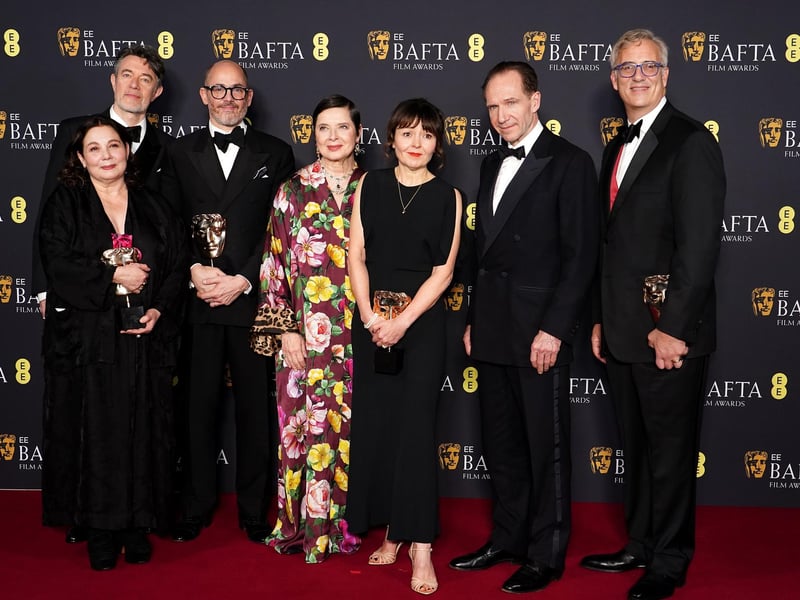 Best Film winners Conclave including Ralph Fiennes, Isabella Rossellini and director Edward Berger in the press room during the 78th British Academy Film Awards