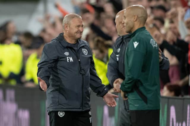 Frankie McAvoy and the rest of the Hearts management team celebrate the win over Rosenborg.