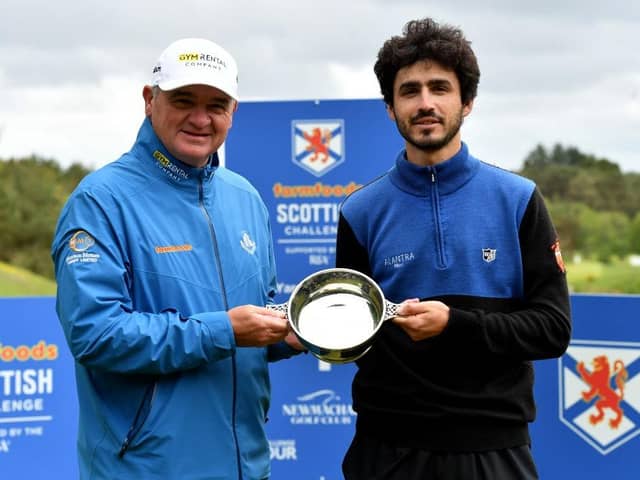 Paul Lawrie presents the trophy to Javier Sainz after the Spaniard's win in this year's Farmfoods Scottish Challenge supported by The R&A at Newmachar in Aberdeenshire. Picture: Mark Runnacles/Getty Images.