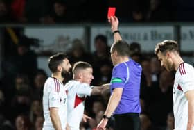 Aberdeen's Graeme Shinnie sees red for a late challenge on Jack Baldwin following a VAR check in the 1-0 win at Ross County.  (Photo by Mark Scates / SNS Group)