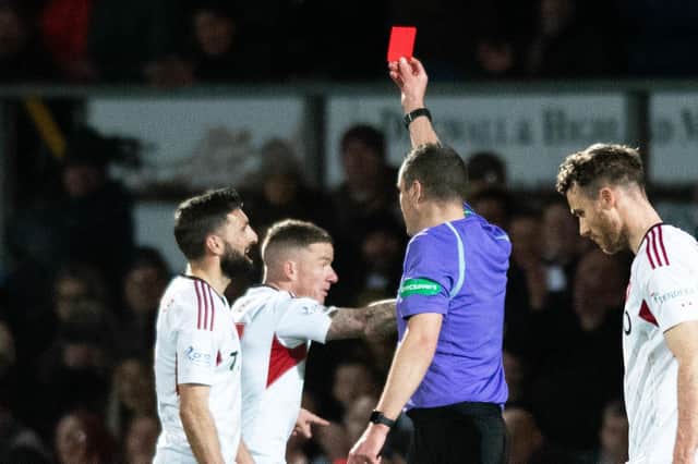 Aberdeen's Graeme Shinnie sees red for a late challenge on Jack Baldwin following a VAR check in the 1-0 win at Ross County. (Photo by Mark Scates / SNS Group)