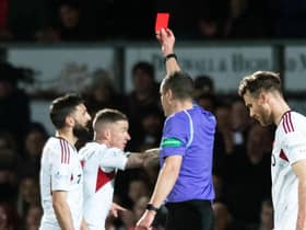 Aberdeen's Graeme Shinnie sees red for a late challenge on Jack Baldwin following a VAR check in the 1-0 win at Ross County.  (Photo by Mark Scates / SNS Group)