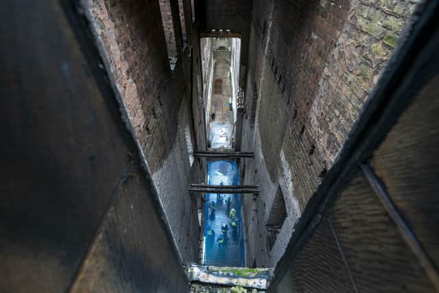 A view down through the floors along the main corridor in the Glasgow School of Art's Mackintosh Building in Glasgow. Picture: Jane Barlow/PA Wire