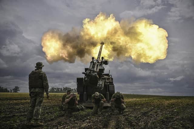 Ukrainian servicemen fire with a French self-propelled 155 mm/52-calibre gun Caesar towards Russian positions at a front line in the eastern Ukrainian region of Donbas. Photo by ARIS MESSINIS / AFP / Getty Images
