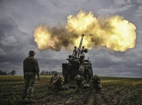 Ukrainian servicemen fire with a French self-propelled 155 mm/52-calibre gun Caesar towards Russian positions at a front line in the eastern Ukrainian region of Donbas. Photo by ARIS MESSINIS / AFP / Getty Images