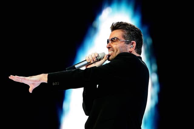George Michael performs during a concert in Amsterdam in 2007. Photo: EVERT ELZINGA/AFP via Getty Images.