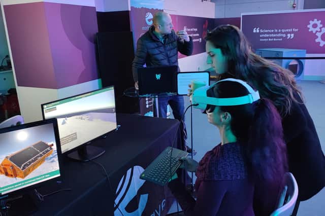 Earthwave founders Martin Ewart and Livia Jakob help school pupils explore the Antarctic environment through VR headsets during a Scottish space sector event at Glasgow Science Centre earlier this year