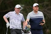 Bob MacIntyre talks with caddie Mike Burrows during a practice round prior to the Sony Open in Hawaii at Waialae Country Club in Honolulu. Picture: Michael Reaves/Getty Images.