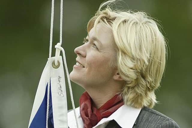 Mhairi McKay raises the Scottish flag during the opening ceremony for the 2002 Solheim Cup at Interlachen Golf Club in Edina, Minnesota. Picture: Scott Halleran/Getty Images.
